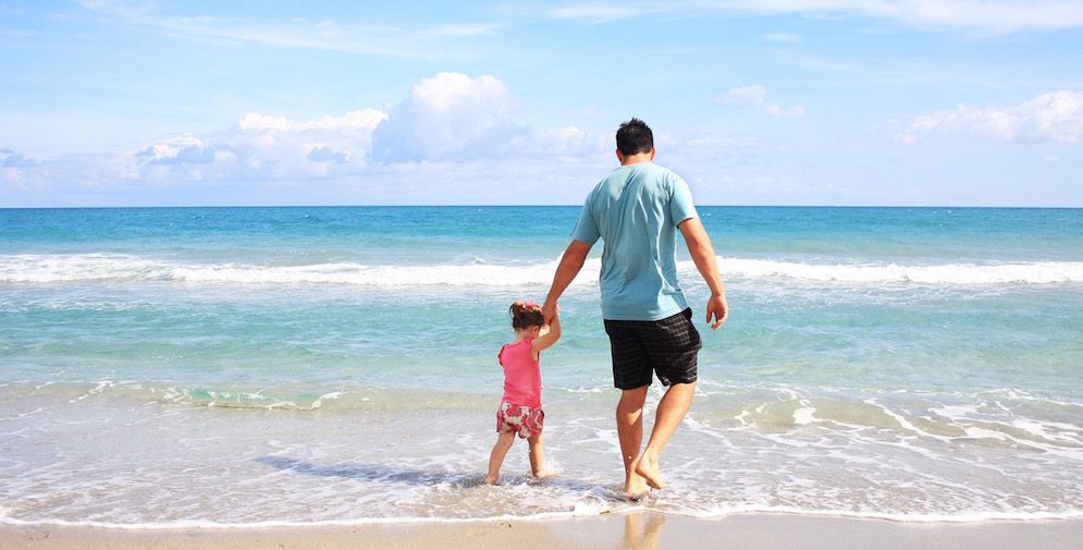 Father and daughter on the beach