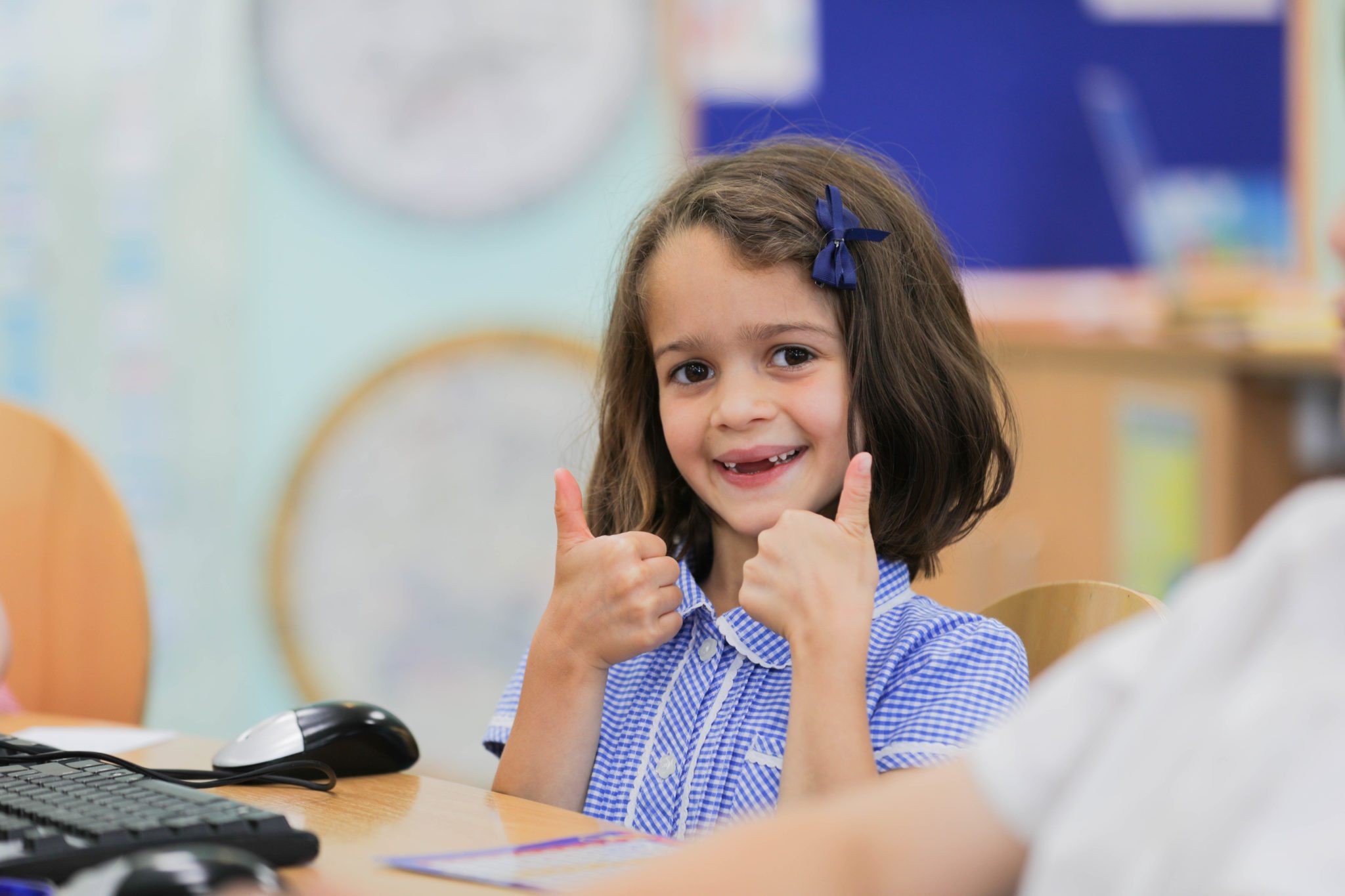 Girl with thumbs up