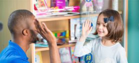 High five with reception student