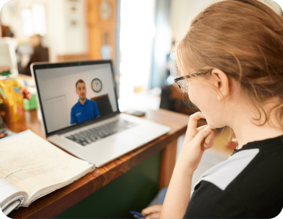 11 Plus student watching Explore tutor on laptop
