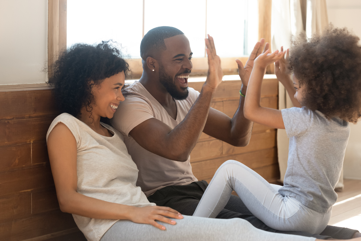 ignite your child's spark - family playing at home