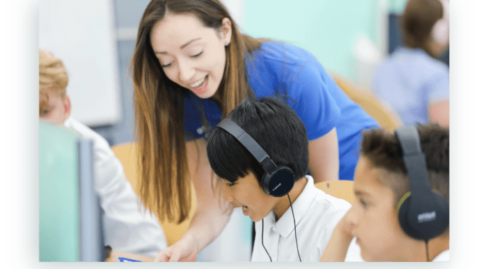 Explore tutor with student with headphones on