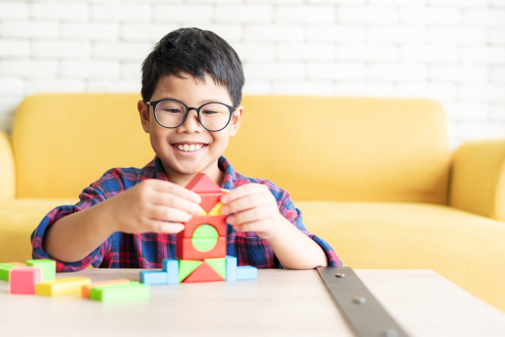 Child playing with building blocks