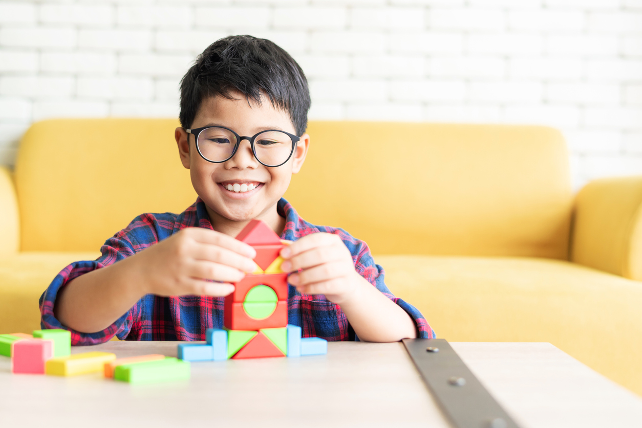 Boy playing with building blocks