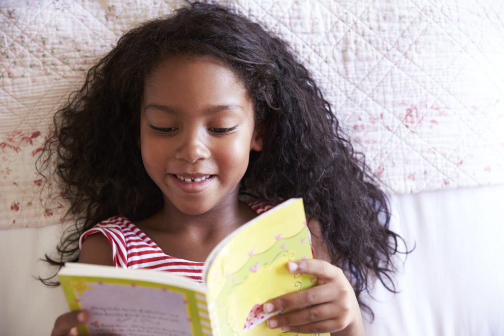 Young girl reading a book